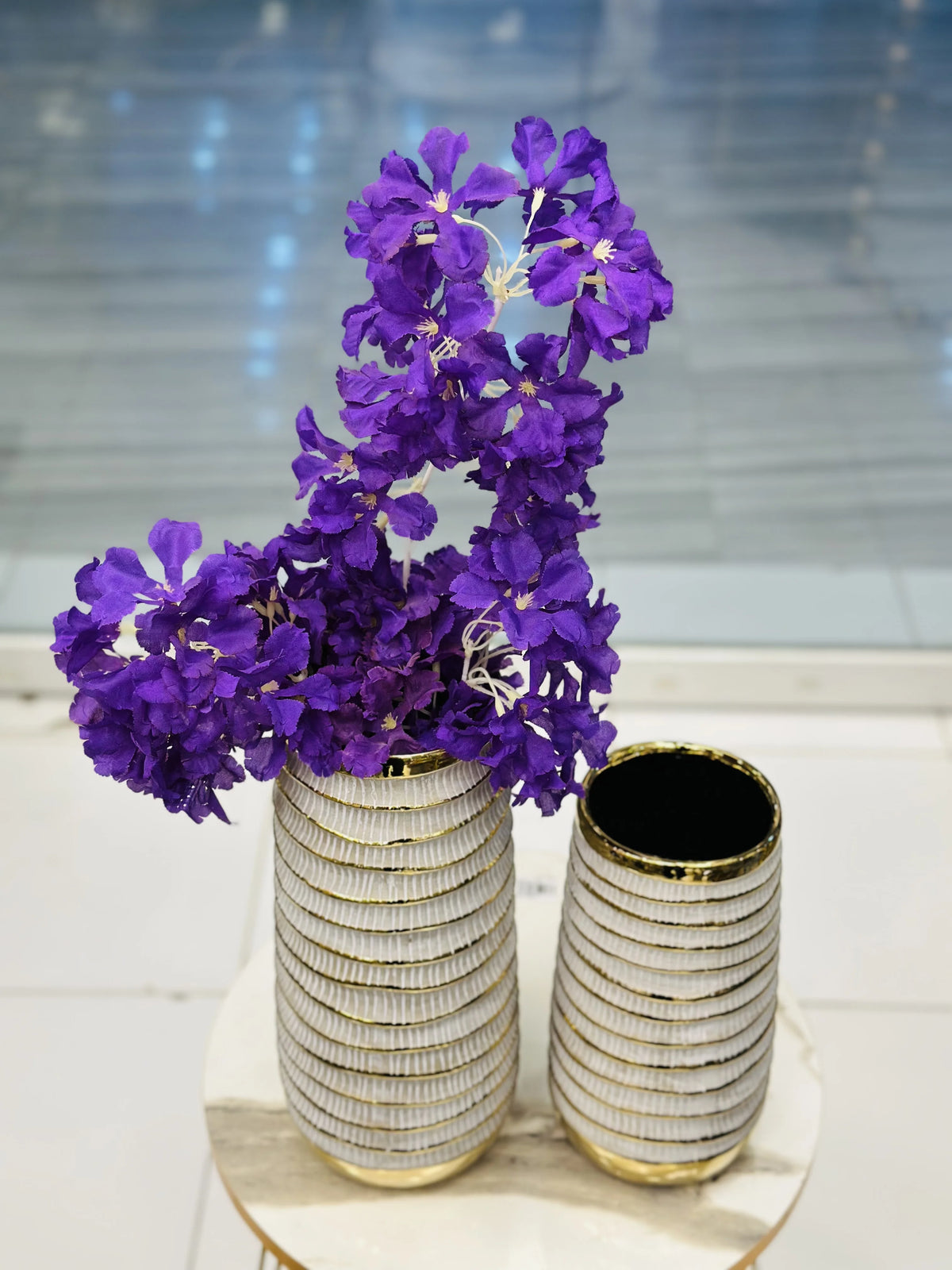 Pair of Ribbed White Ceramic & Gold Vases with Purple Floral Blossoms